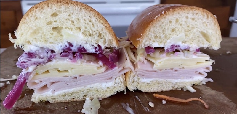 Close up photo of turkey provolone sandwich.